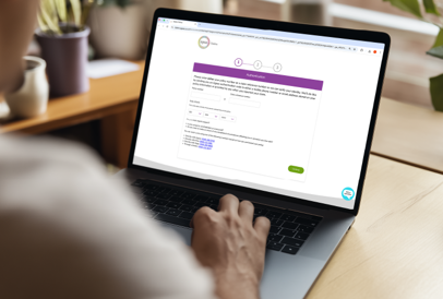 Laptop with screen showing the claims page on the Ageas website